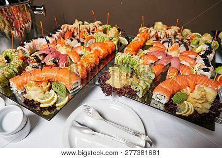 Decorated Catering Banquet Table With Different Sushi Rolls And Nigiri Sushi Plate Assortment On A P