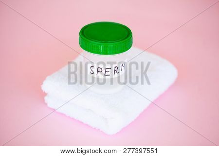 Health. Close Up Sperm Analysis. Concept Of Bank Sperm. Infertility Bank With Sperm On Pink Backgrou
