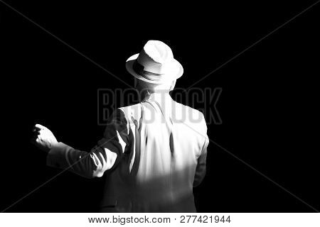 A Stranger In A White Suit And A White Hat In The Night