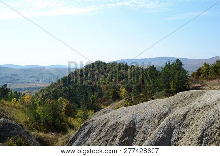 A Landscape Of A Hill With Vegetation From The Land Of Mud Volcanoes, Berca, Romania.