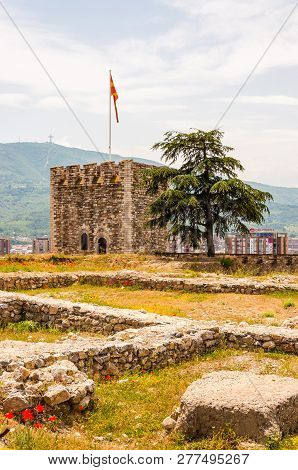 Skopje, Macedonia - June 10, 2013: Ancient Stone Tower As A Part Of Ancient Fortress With Growing Bl