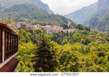 Litochoro, Greece - June 16, 2013: Popular touristic panoramic viewpoint on Mount Olympus from below from Litochoro town with its cozy hotels, apartments, scenic cityscape views and forest surroundings
