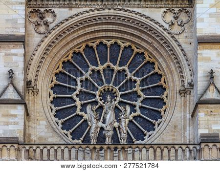 Closeup View Of The Notre Dame De Paris Cathedral Facade With The Oldest Rose Window Installed In 12