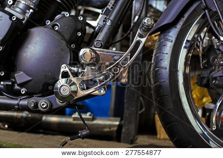 Cropped Close Up Shot Of Beautiful And Custom Made Motorcycle In The Workshop