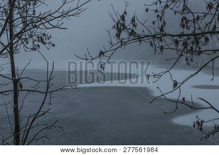 Frosty Pond With Mist And Snow In Dark White Winter Day Near Spa Town Kynzvart
