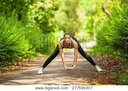 Fitness. Athlete Girl, Thlete Exercise At Outside, Woman Fitness. Young Beautiful Woman Stretching I