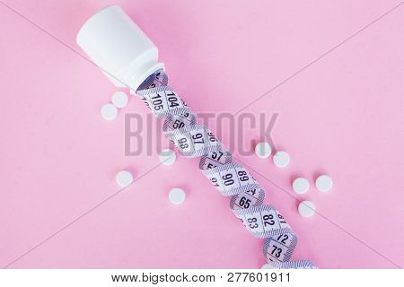 Close Up Of Pills. Dietary Supplements. Variety Pills. Vitamin Capsules On Pink Background
