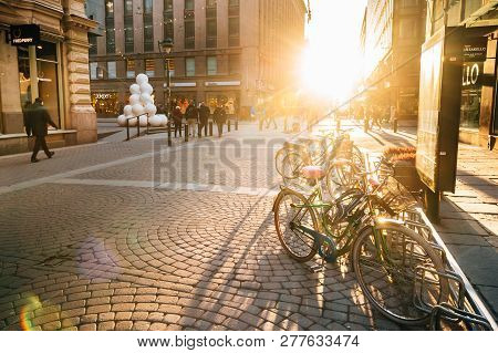 Helsinki, Finland - December 11, 2016: Bicycles Parked Near Storefronts In Kluuvikatu Street. View O