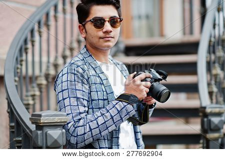 Stylish Indian Young Man Photographer At Sunglasses Wear Casual Posed Outdoor Against Iron Stairs Wi