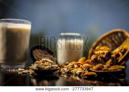 Close Up Of Popular Indian And Asian Winter Drink On Wooden Surface I.e. Kharek Ka Dudh Or Dried Dat