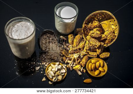 Close Up Of Popular Indian And Asian Winter Drink On Wooden Surface I.e. Kharek Ka Dudh Or Dried Dat