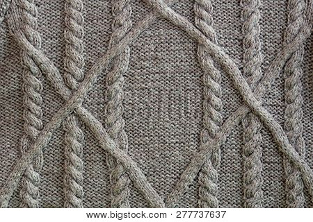 Gray Knitted Fabric Texture With A Pattern Of Their Braids