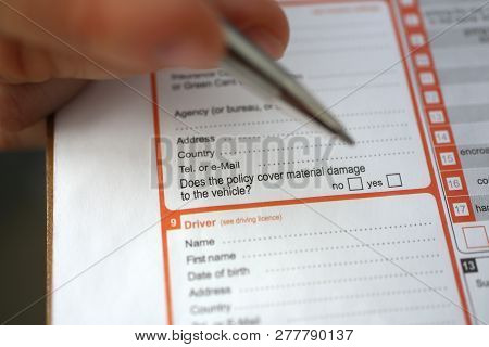 Male Insurer Hand Hold Silver Pen An Accident Europrotocol Closeup. Risk Transportation Representati