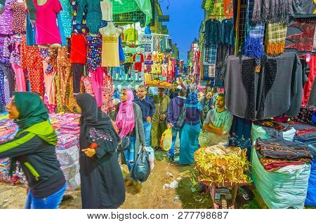 Cairo, Egypt - December 20, 2017: The Young Women Making An Evening Shopping In Clothing Street Of K