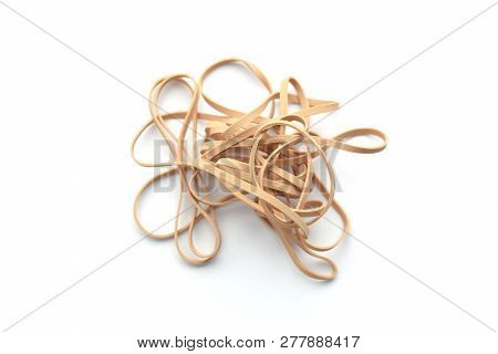 Pile Of Beige Stretchy Rubber Bands - Isolated