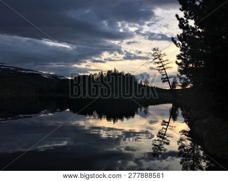 Twilight On The Lake Among The Mountains Of The Ulagansky District Of The Altai Republic