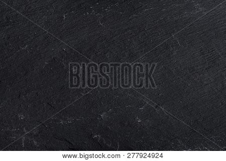 Dark Gray Black Slate Background Or Texture Of Natural Stone. Black Board For Serving Close-up