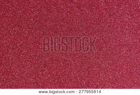 Red Glitter Texture For Background. Texture For The Design Of Greeting Cards And Other