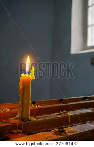 Burning Candle At Koknese Evangelical Lutheran Church. Evangelic Lutheran Church In Koknese, Latvia.