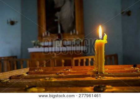 Burning Candle At Koknese Evangelical Lutheran Church. Evangelic Lutheran Church In Koknese, Latvia.