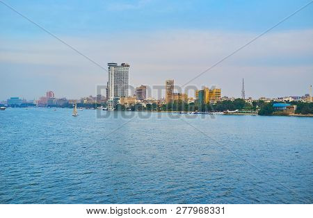 The Foggy Buildings Of Rhoda Island Behind The Wide Nle River, Cairo, Egypt.