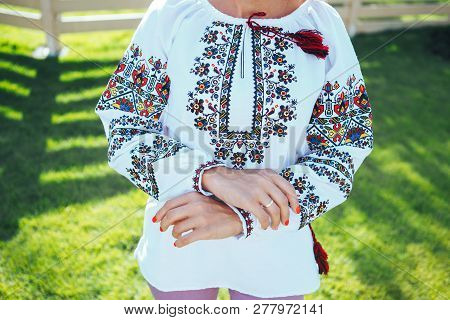 Beautiful Young Woman In Traditional Ethnic Ukrainian  Style. Vyshivanka Blue With White Embroidery