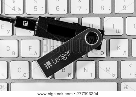 UKRAINE, ROVNO - ON JANUARY 11: Ledger hardware wallet for cryptocurrency on a white keyboard