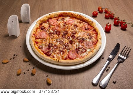 Pizza Is Super Meat Thin Cake, Tomato Sauce, Beef Balyk, Ham, Bacon, Hunting Sausages Italian Salami
