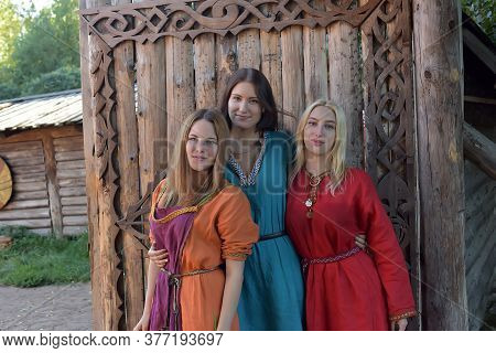 Three Girls Dressed In Historical Medieval Reconstruction Varangian Manor, Russia