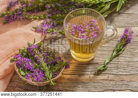 Fireweed Is A Healthy Herbal Tea. Mug Of Traditional Russian Drink Ivan Tea On A Wooden Background W