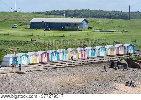 Multi Coloured Beach Huts Facing The Beach At Bude Cornwall