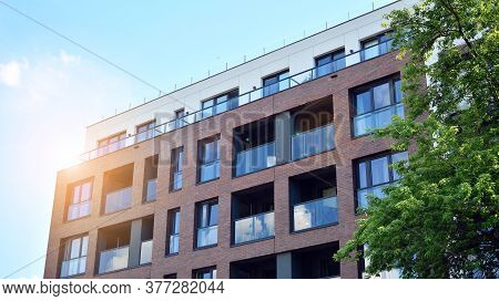 Contemporary Residential Building Exterior In The Daylight. Modern And New Apartment Building. Multi