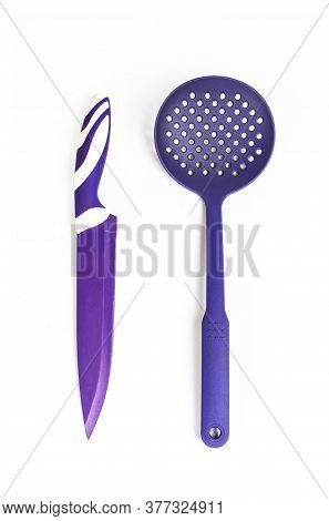 Purple Knife And Skimmer On A White Background
