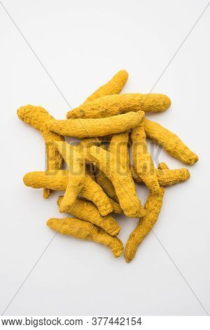 Haldi Or Dried Turmeric Roots As A Whole On White Background