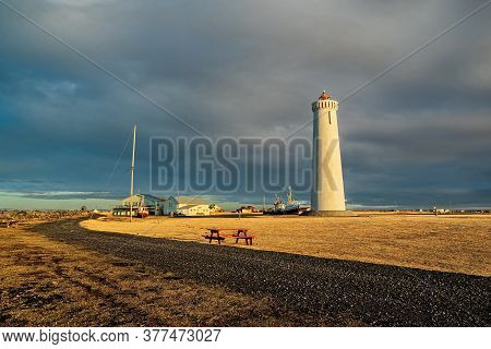 Gardur Lighthouse And Old Ships At Sunset, Iceland