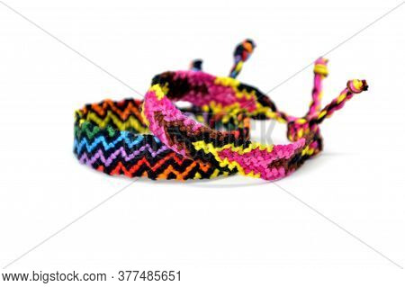 Selective Focus Of Tied Woven Friendship Bracelets With Bright Colorful Pattern Handmade Of Thread I