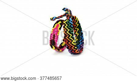 Selective Focus Of Tied Woven Friendship Bracelets With Bright Colorful Pattern Handmade Of Thread I