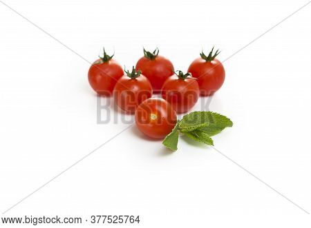 Cherry Tomatoes And Mint On A White Background
