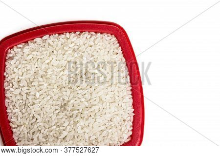 Rice In A Container On A White Background Top View