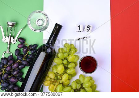A Bottle Of Wine, Grapes, And The Flag Of Italy Close-up. Country Symbol Backdrop. The Concept Of Ha
