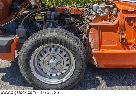 Toronto, Canada, July 2020 - Side View Of A Triumph Spitfire Vintage Car With Open Bonnet Showing Th