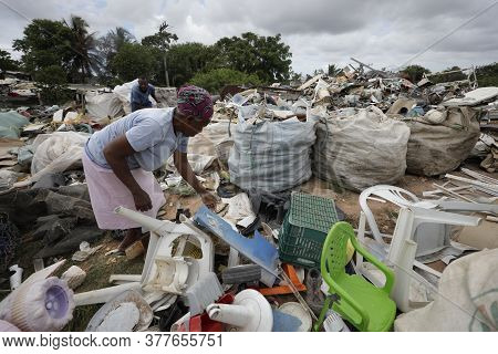 Lauro De Freitas, Bahia / Brazil - March 14, 2019: Woman Is Seen Collecting Material For Recycling A