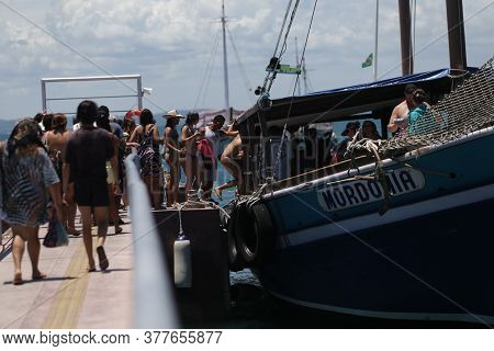 Salvador, Bahia / Brazil  - January 31, 2019: Passengers Are Seen At The Pier Of Ilha Dos Frades Sch