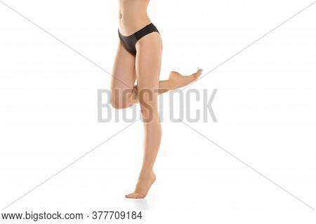 Beautiful Female Legs, Buttlocks And Belly Isolated On White Background. Beauty, Cosmetics, Spa, Dep
