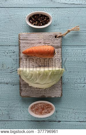 Cabbage Fermenting Ingredients On Blue Wooden Vertical Textured Background. Piece Of Cabbage, Carrot