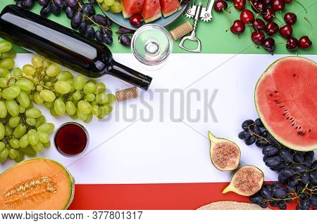 A Bottle Of Wine, Wineglass, Grapes, Different Fruits And The Flag Of Italy. Country Symbol Backdrop