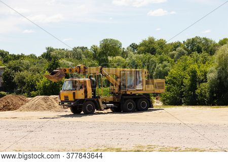 Yellow Excavator Cart Mounted On A Car.