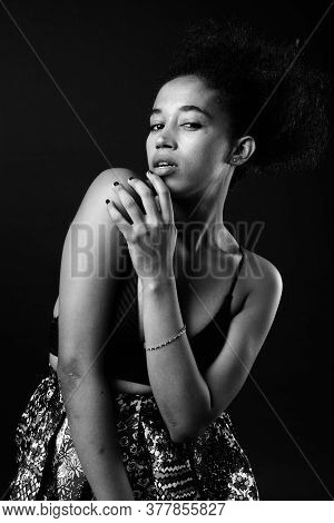 Young Beautiful African Woman With Afro Hair In Black And White