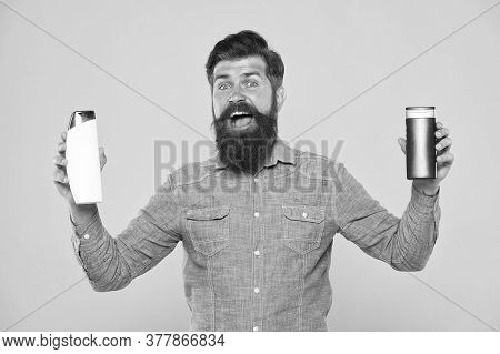 Bath Cosmetics. Man Bearded Hipster Hold Shampoo Bottles. Hair Care. Shampoo For Daily Use. Skin Lot