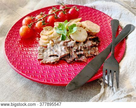 Beef meat stewed with potatoes-Traditional French cuisine Beef Bourguignon potatoes carrots in persillade